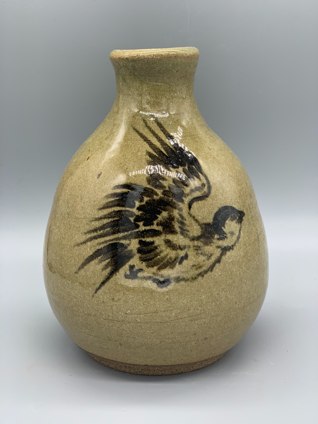 Bird in flight illustration on vase